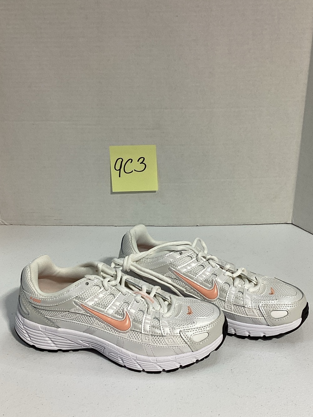 Nike Kids White Sneakers with Light Pink Swoosh